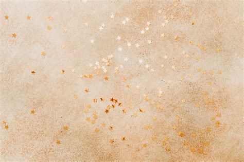 Premium Photo | Beige stone background with golden stars on in