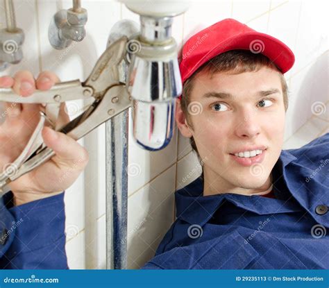 Plumber in uniform stock image. Image of pliers, smile - 29235113