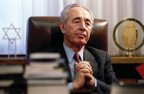 THE LATE Shimon Peres at his desk in 1994.