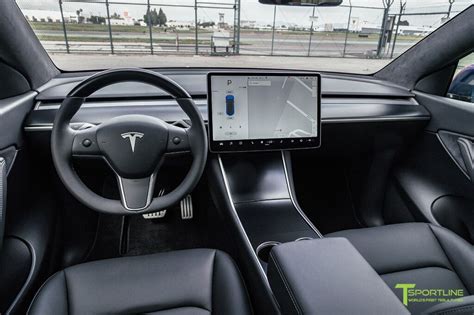 the interior of a tesla car with an electronic display