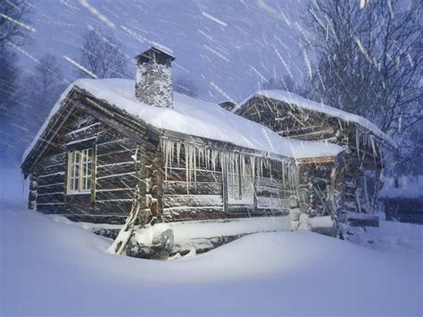 My family's 200-year-old cabin during a snowstorm this morning, deep in ...