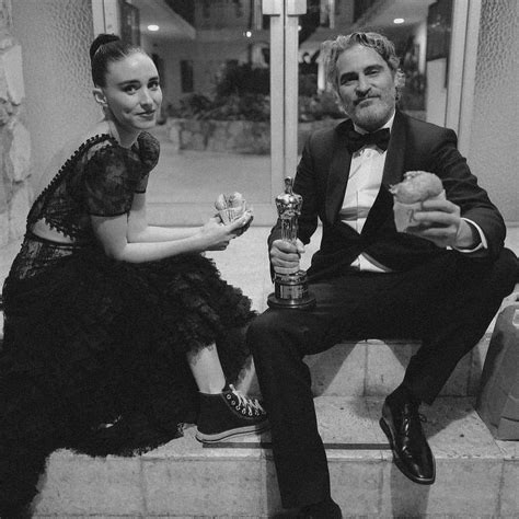 Joaquin Phoenix and Rooney Mara photographed by Greg Williams at the Oscars enjoying a burger ...