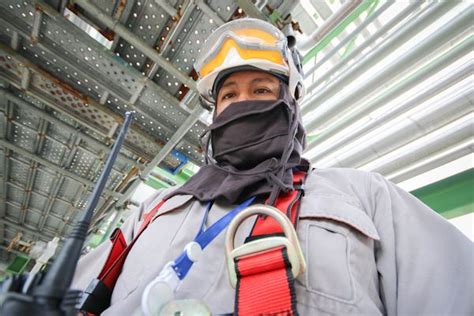 Worker outfitted with required PPE