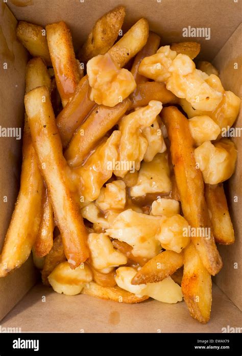 Poutine - a Canadian delicacy of french fries gravy and cheese curds ...