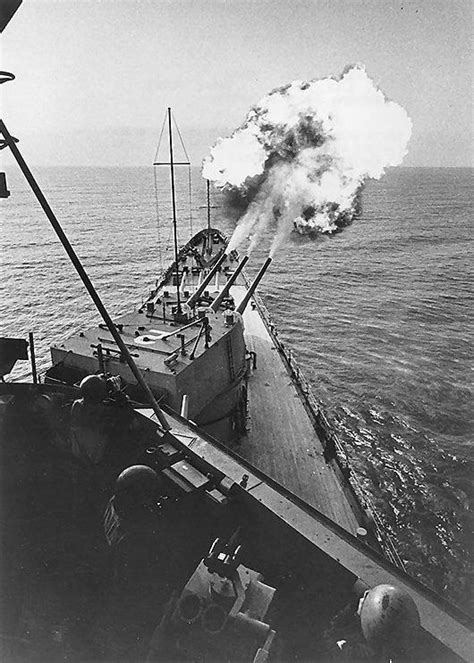 USS Canberra USS Canberra bombarding the coast of Vietnam, Mar 1967; note projectiles visible to ...