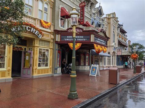 PHOTOS: Main Street, U.S.A. Lampposts Begin to Receive Gold Accents for Walt Disney World's 50th ...