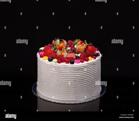 Delicious birthday fruit cake for dessert, black background Stock Photo ...