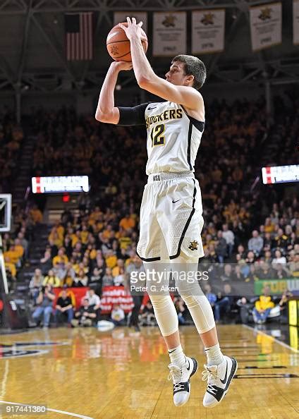 Austin Reaves of the Wichita State Shockers shoots a three-point shot ...