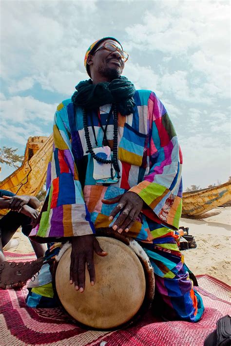 Senegalese man playing the drum. | Senegal, African culture, Culture