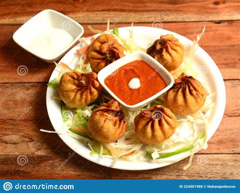 Veg Fried Momo with Mayonnaise Served Over a Rustic Wooden Background ...