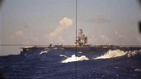 Aircraft carrier USS Enterprise (CVN-65) seen through the periscope of German Navy's Type 206 ...