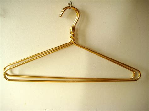 pair of vintage gold aluminum hangers / Dodco by EightLotsRoad