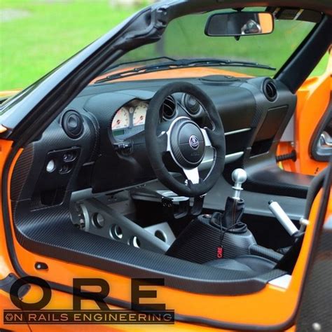 the interior of an orange sports car is shown