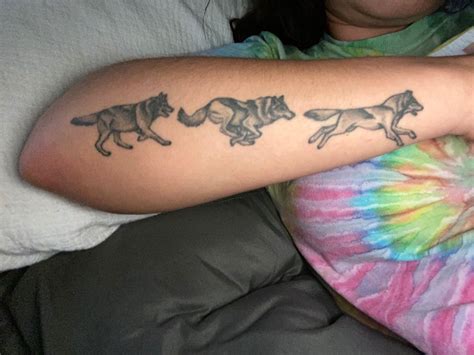 Wolf pack tattoo | Running tattoo, Wolf pack tattoo, Around arm tattoo