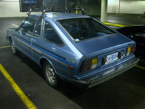 OLD PARKED CARS.: 1982 Datsun 210 Hatchback.