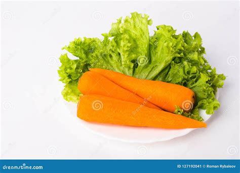 3 Carrots and Lettuce Leaves on a White Plate Stock Image - Image of orange, food: 127192041