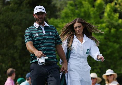 Paulina Gretzky caddies for Dustin Johnson before 2023 Masters