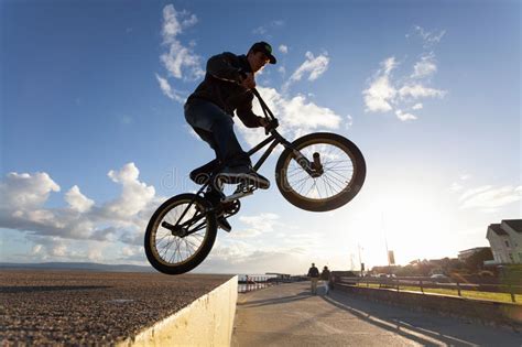 BMX stunts at the street stock image. Image of actions - 33758337
