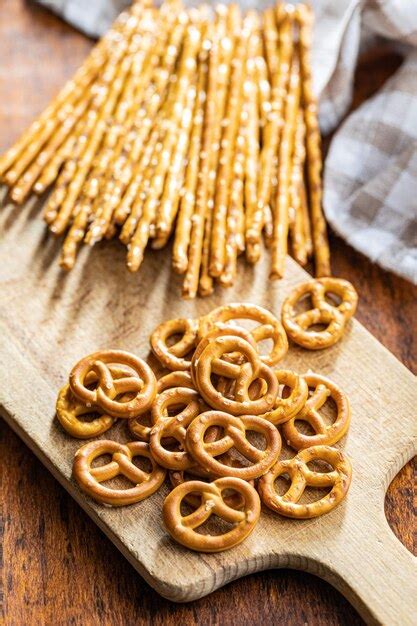 Premium Photo | Mini pretzels and salted sticks crusty salted snack on ...