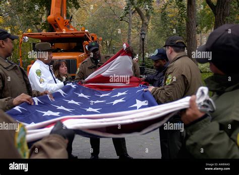 Folding an American flag Stock Photo - Alamy