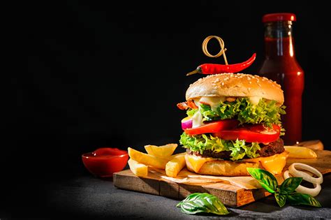 Photo Hamburger French fries Ketchup Food bottles Vegetables Cutting