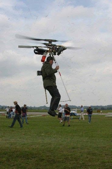 Backpack helicopter, using small rockets at the tips of the blades for ...