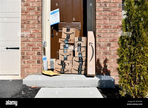 Amazon Prime boxes delivered and stacked at the front door of a ...