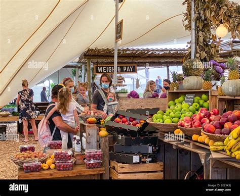 CAPE TOWN, SOUTH AFRICA - Dec 28, 2020: Locals and tourists with face masks at the Oranjezicht ...