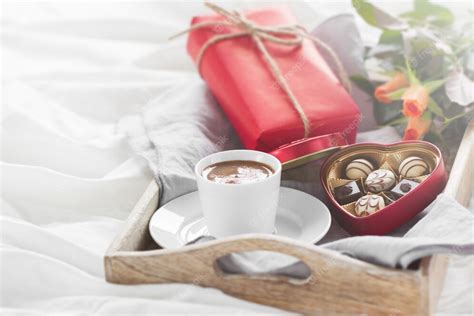 Free Photo | Breakfast tray with a gift, flowers and chocolates