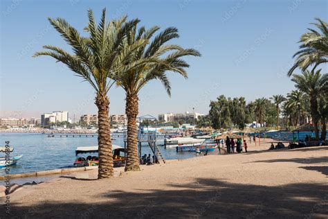 Touristic ships on the beach of Aqaba, Jordan. Popular resort, located at the north of the Red ...