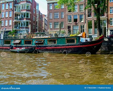 Houseboat on a Barge in Amsterdam Editorial Stock Image - Image of ...