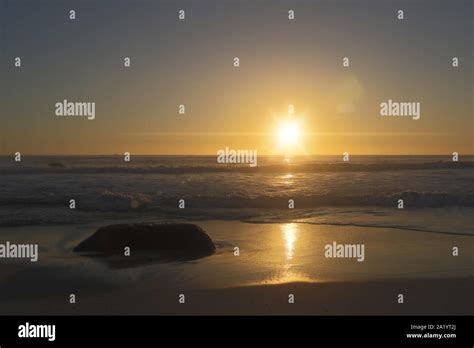 Sunset on a beach in Cape Town , South Africa Stock Photo - Alamy