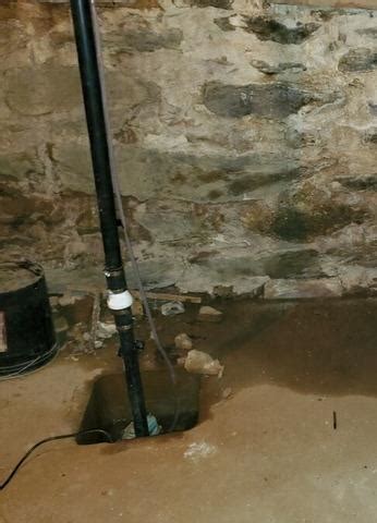 DryZone Basement Systems Before & After Photo Set - TripleSafe Sump Pump Installation In Amherst, MA