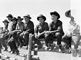 Several cowboys sit on a fence and listen to the foreman’s… | Flickr