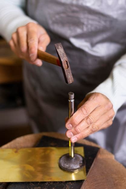 Free Photo | Carpenter hammering a nail