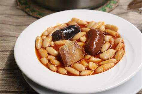 Premium Photo | Fabada typical asturian dish made with beans chorizo black pudding and bacon