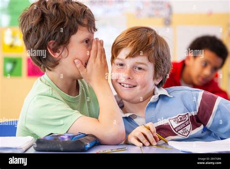 School children talking in a classroom Stock Photo - Alamy