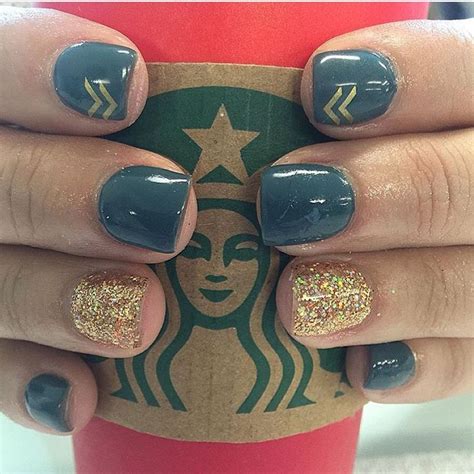 Nails. Teal and gold with an arrow or two ... They look good on my Starbucks Nails by Brandi ...