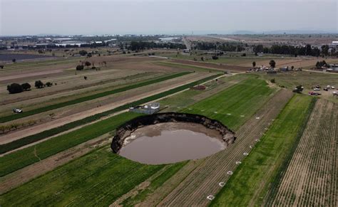 Sinkhole at Mexico farm swallows more land, eats at house Mexican ...