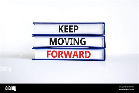 Keep moving forward symbol. Concept words Keep moving forward on books ...