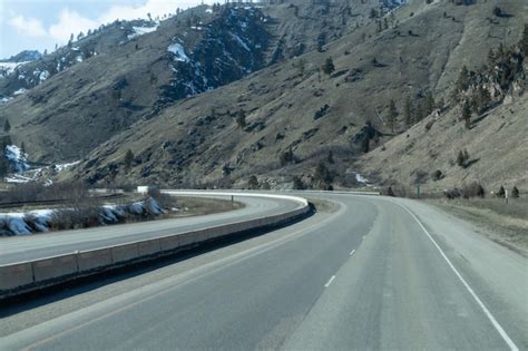 Premium Photo | A highway with a mountain in the background