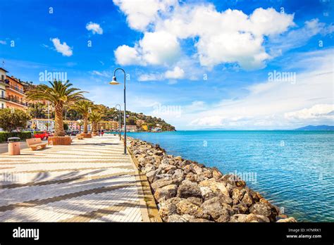 Promenade seafront or esplanade in Porto Santo Stefano harbor, Monte Argentario, Tuscany, Italy ...