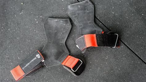 Should you Choose Lifting Grips or Lifting Straps? - GYMREAPERS