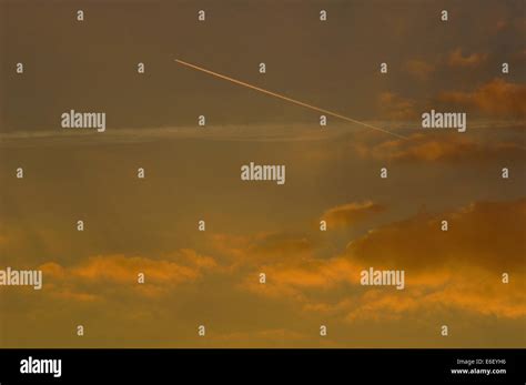 A Jet Leaving A Vapor Trail Stock Photo - Alamy