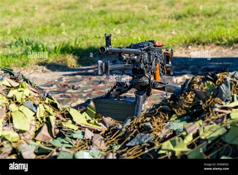 Soviet-made PK machine gun and camouflage netting.. "Kalashnikov's machine gun Stock Photo - Alamy