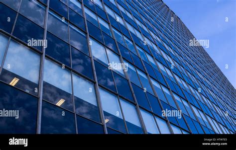 Modern glass skyscraper facade perspective view Stock Photo - Alamy