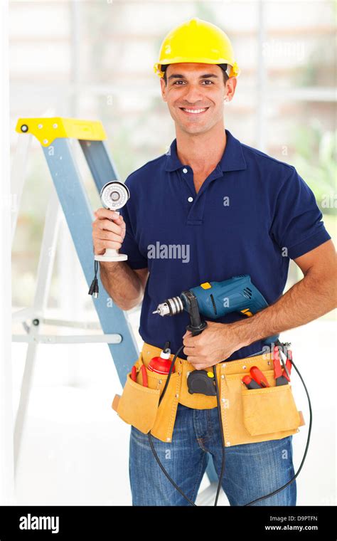 security surveillance system installer with cctv camera and tools Stock Photo - Alamy