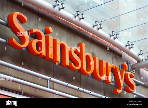 Sainsbury's logo above outlet Stock Photo - Alamy