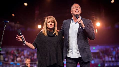 Disgraced founding pastor Brian Houston feuds online with Hillsong about his wife's future