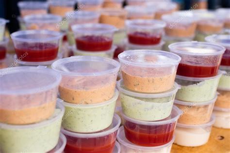 Sauces in plastic containers for buffet — Stock Photo © nikolodion ...